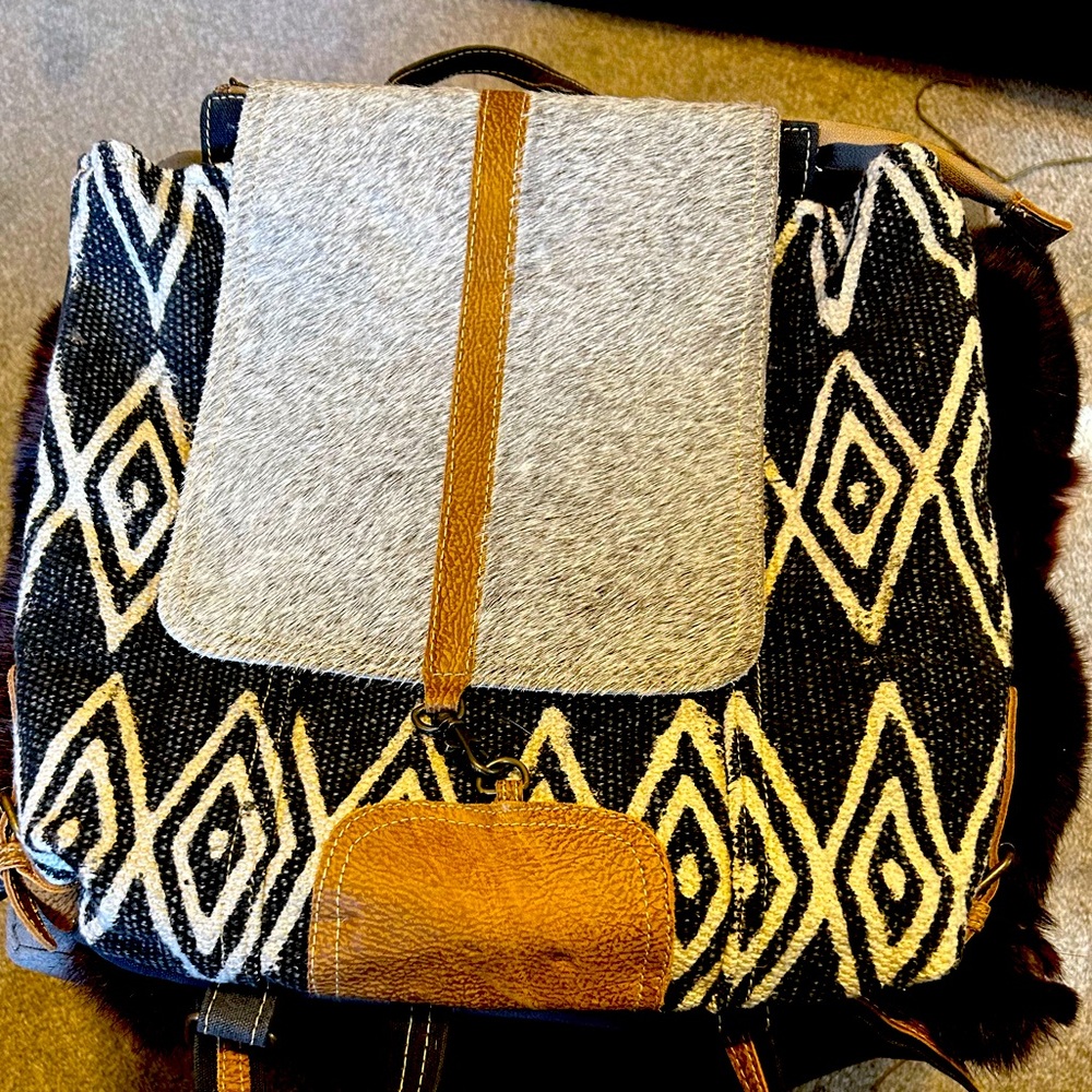 Myra backpack NWT, beautiful fur flap with lock closure.